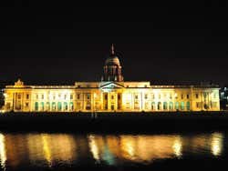 Dublin Custom House seen from across the water, lit up at night