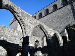 St Audoen's Church ruins under a blue sky